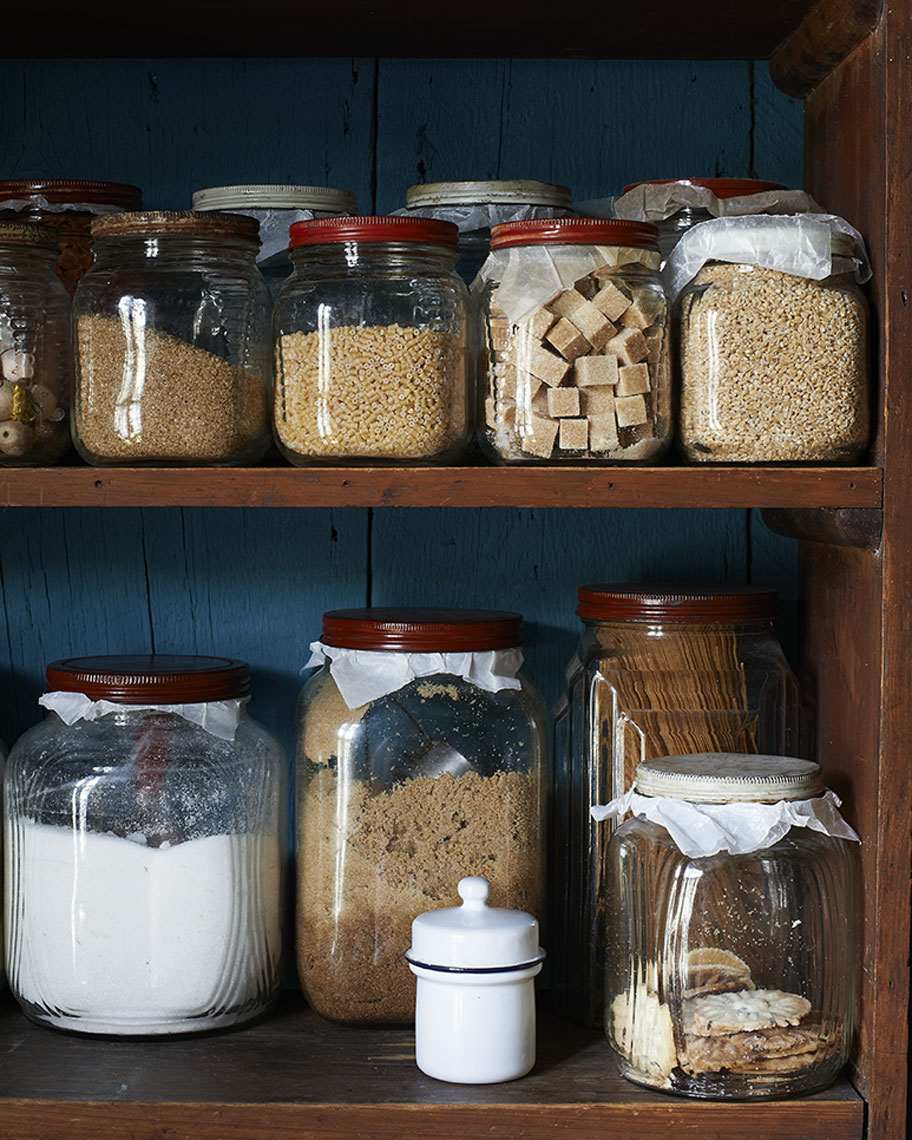 Moody pantry glass jars of pasta and grains in Still-life by Alison Gootee Photography