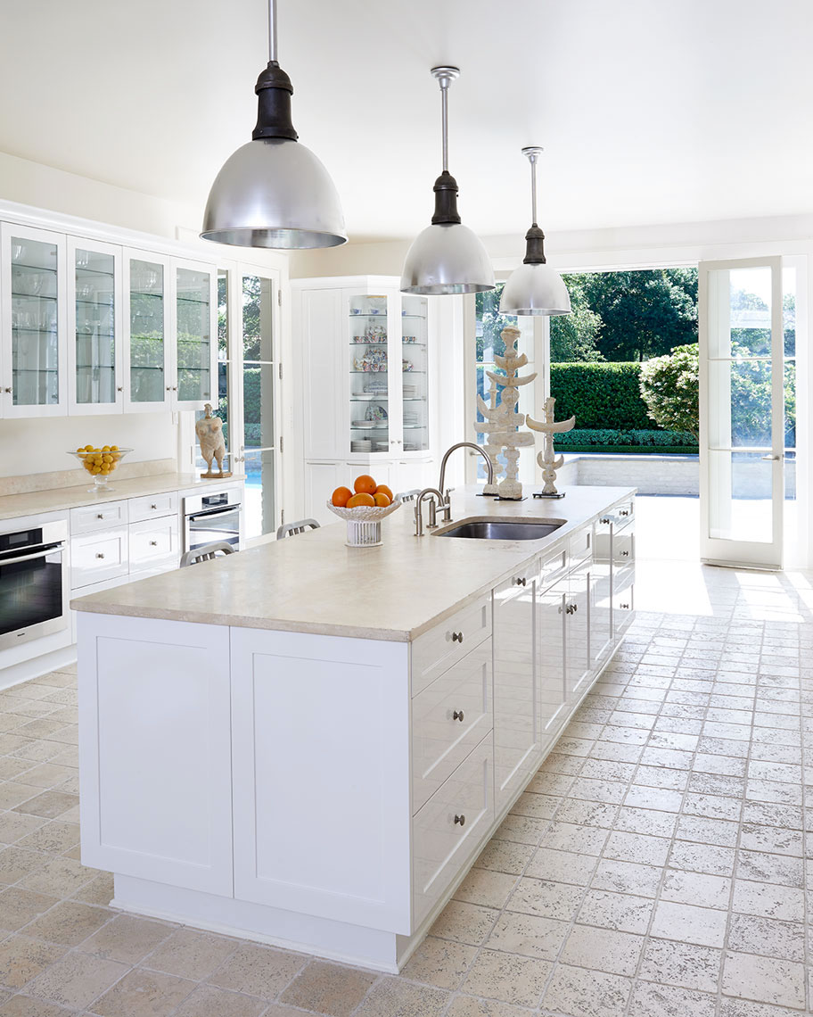 white kitchen island to outdoor space by Alison Gootee Photography