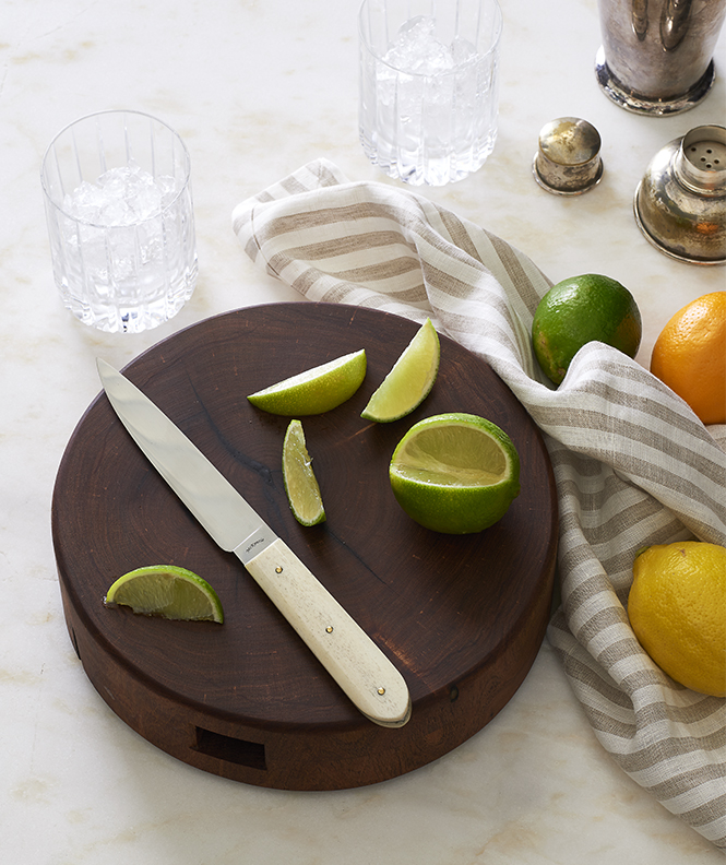 Cocktail cutting board with citrus and knife Still-life by Alison Gootee Photography