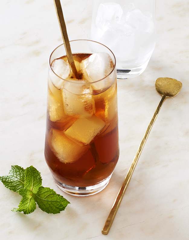 glass of sweet iced tea with a stirrer is food photography by Alison Gootee Photography