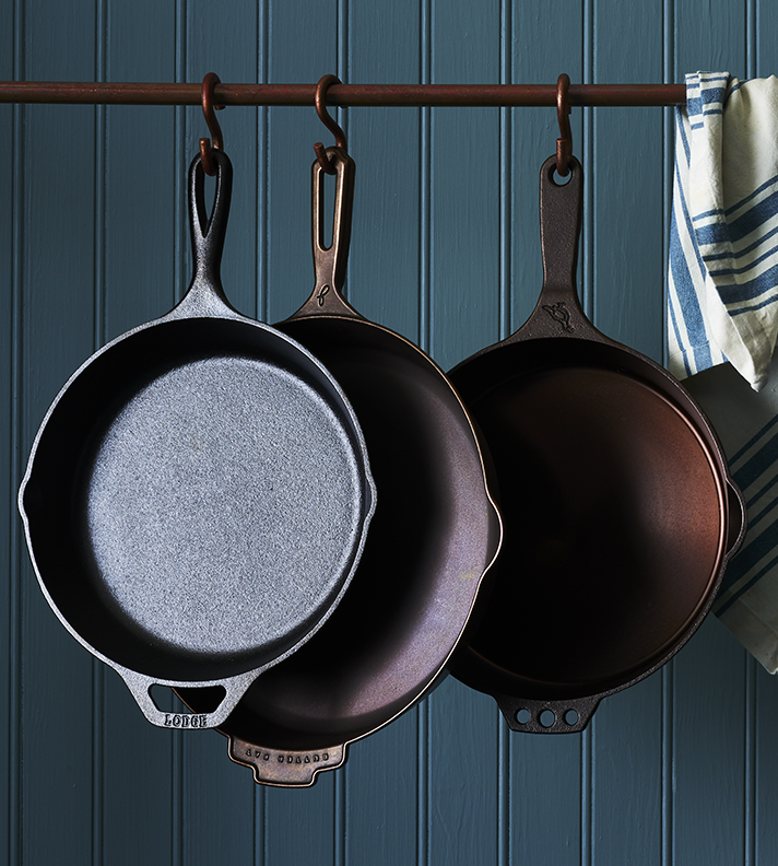 Moody cast iron skillets on a rack Still-life by Alison Gootee Photography