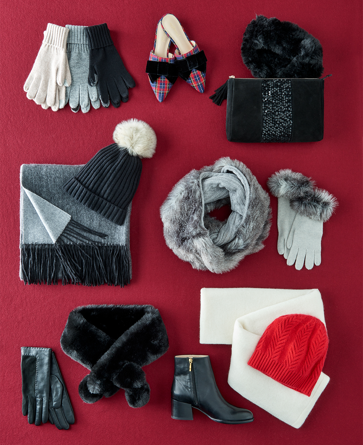 Winter accessories on red background by Alison Gootee Photography 
