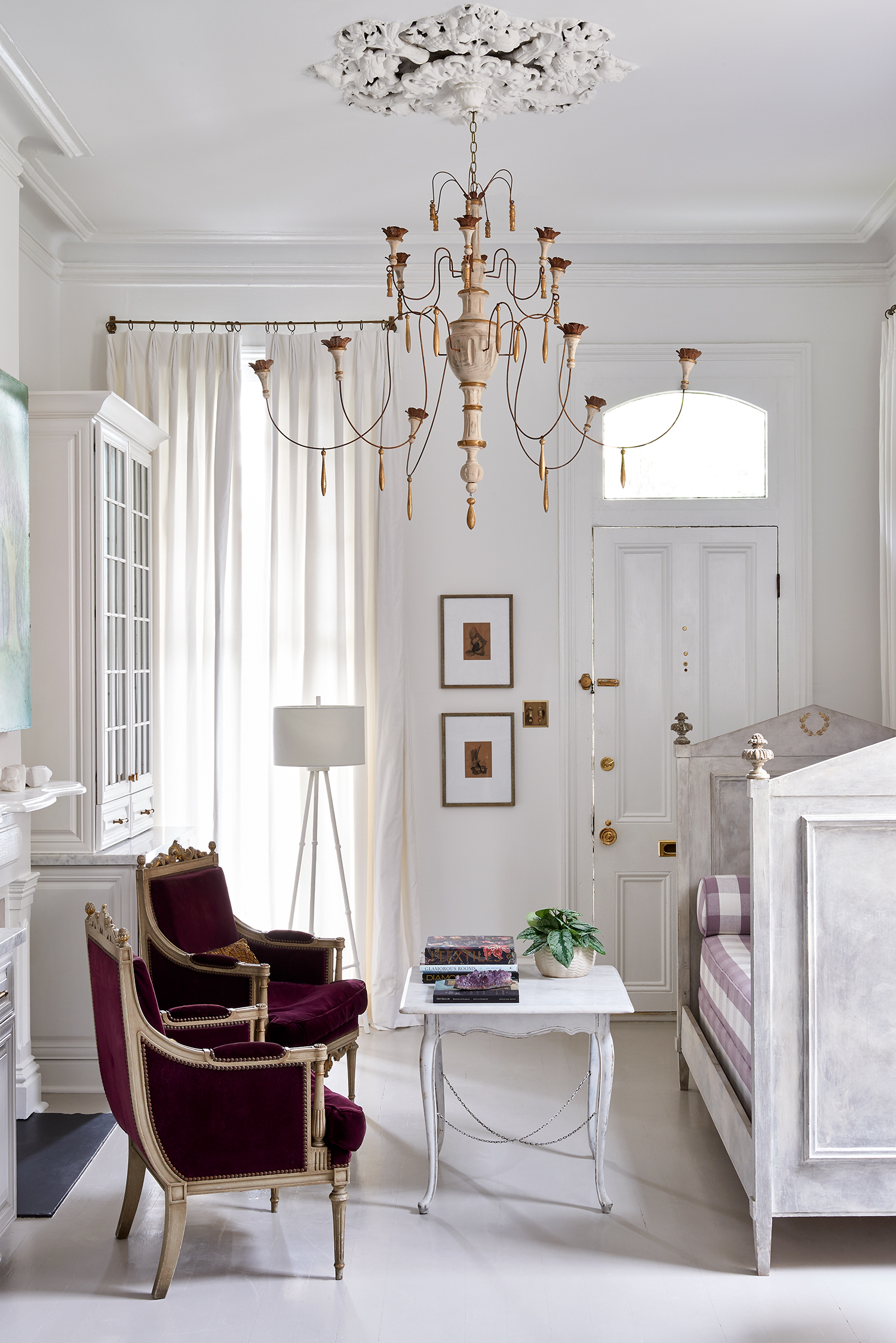 Bright white sitting room in the New Orleans home of Julie Neill in Garden and Gun Magazine by Alison Gootee photography