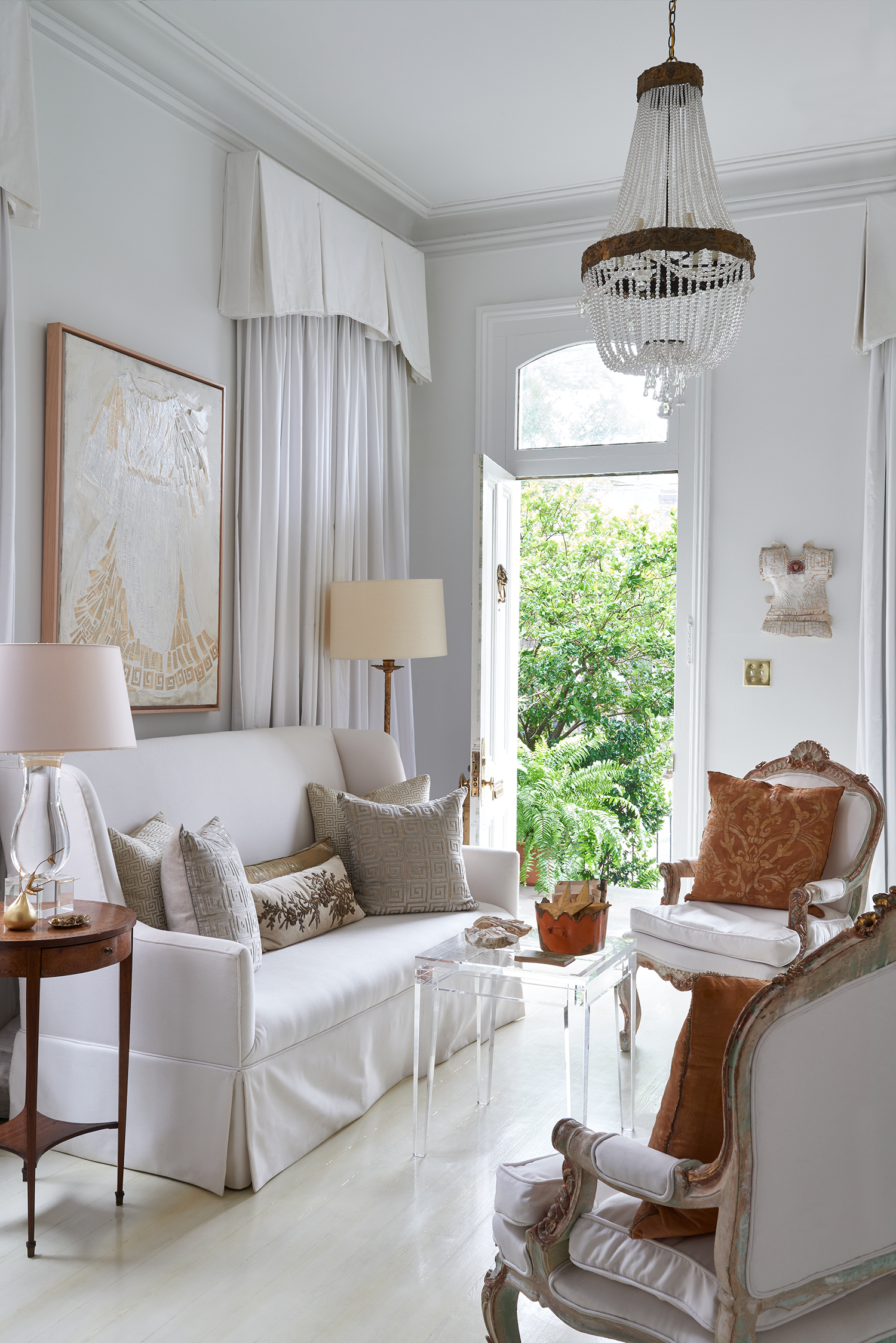 Entry way of white front room in the New Orleans home of Julie Neill in Garden and Gun Magazine by Alison Gootee photography