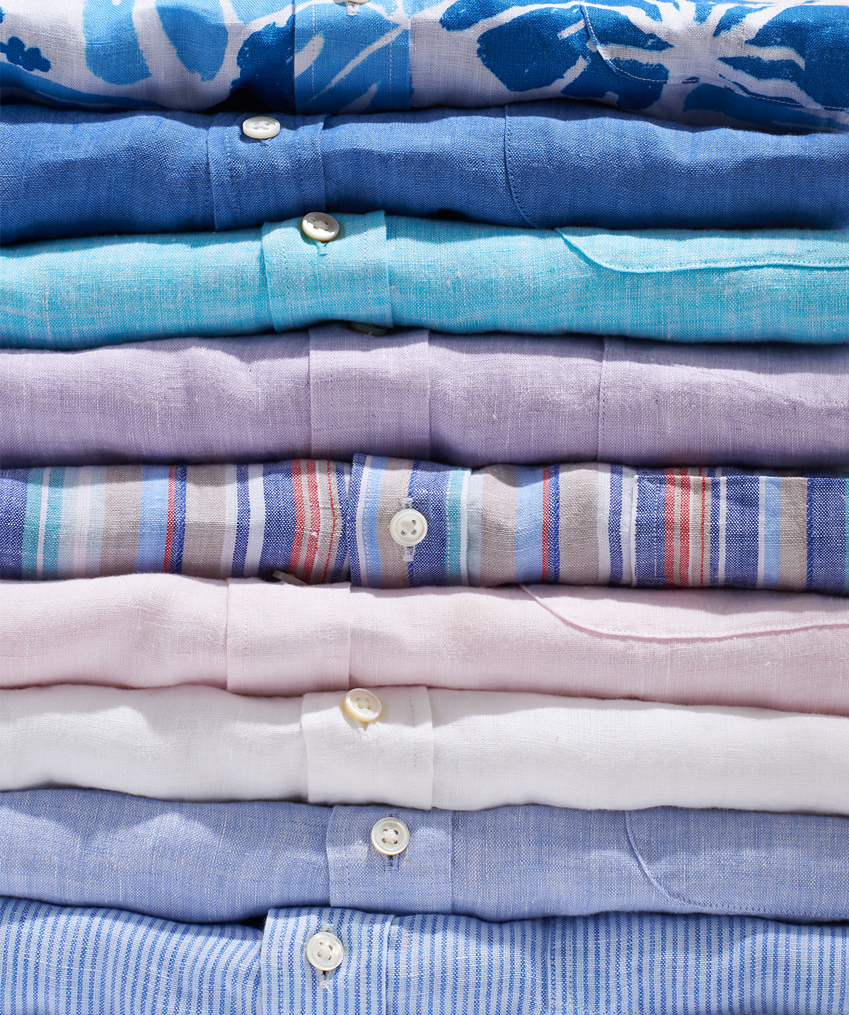 close up of stack of button down shirts by Alison Gootee Photography 