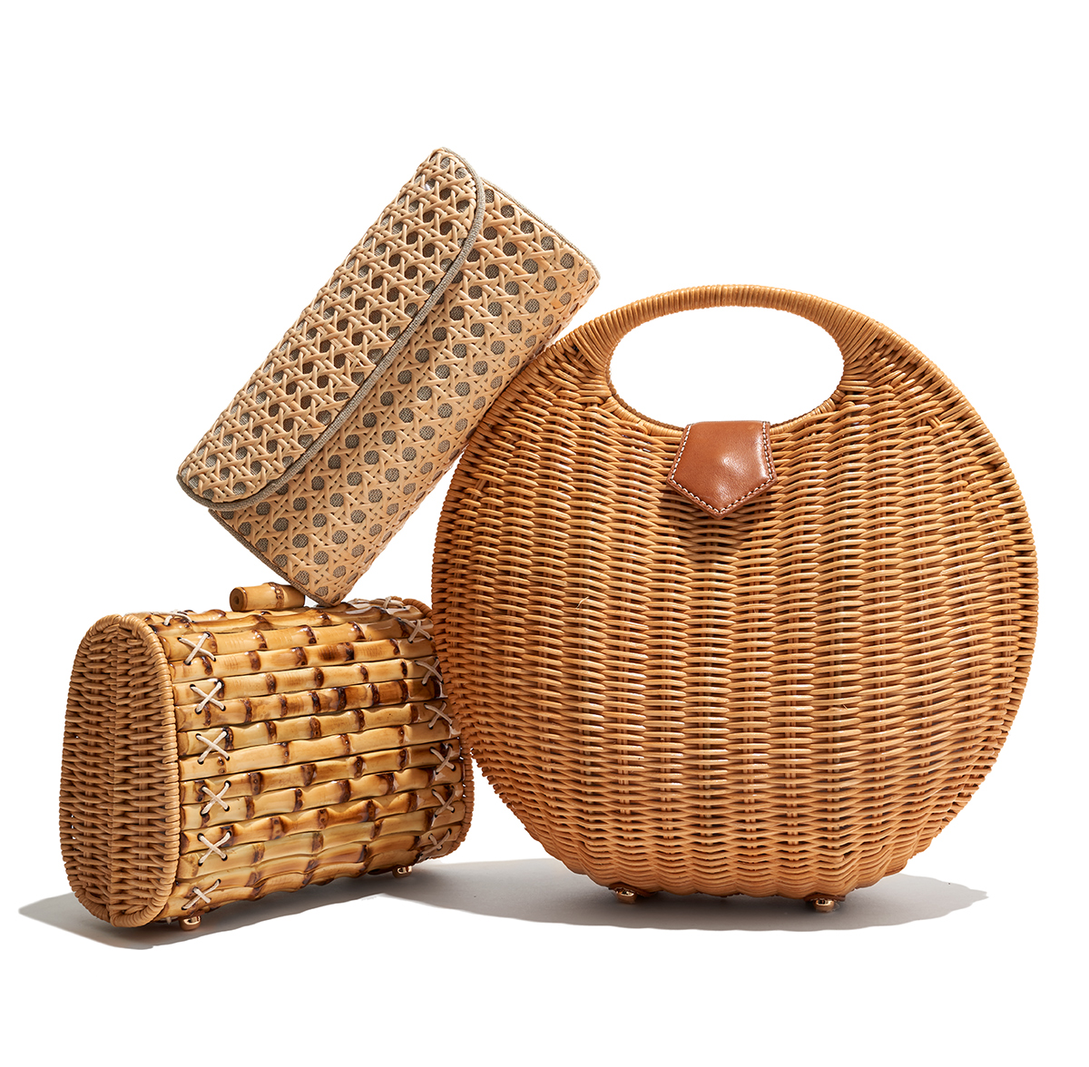 Straw fashion handbags on white background by Alison Gootee Photography 