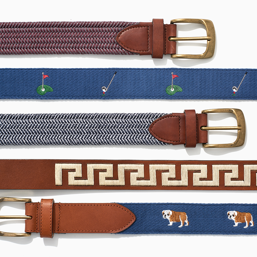 Mens embroidered fashion belts on white background by Alison Gootee Photography 