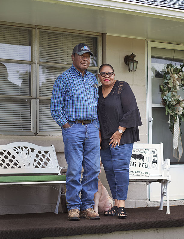 Black Farmer couple on porch of home by Alison Gootee Photography