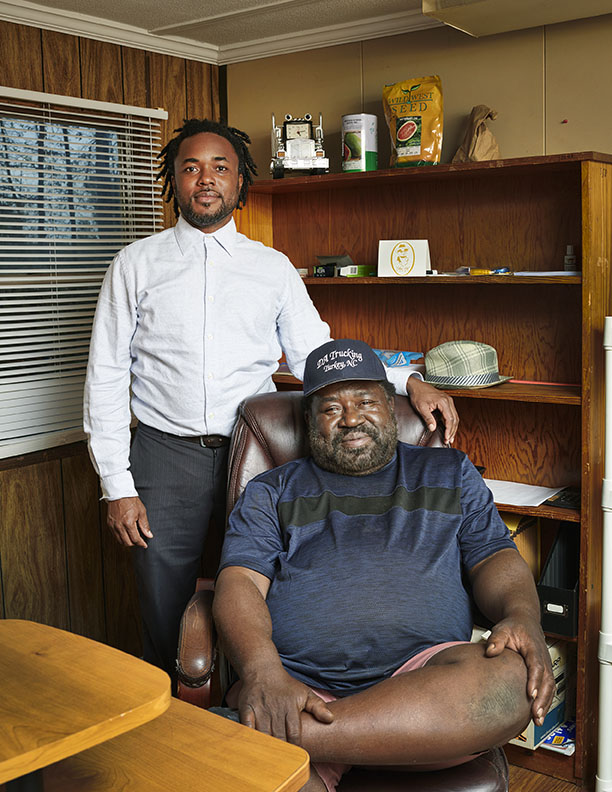 Father and son Black Farmers in office by Alison Gootee Photography