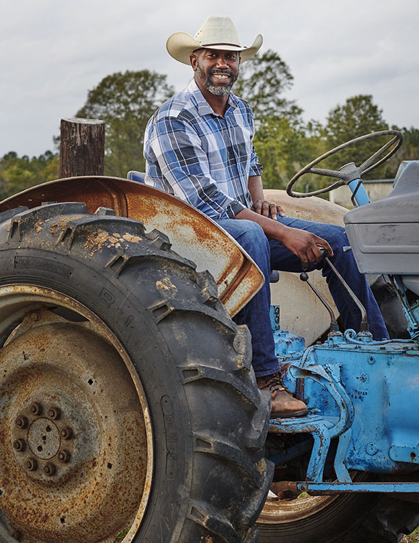 Black farmer on tractor portrait by Alison Gootee Photography