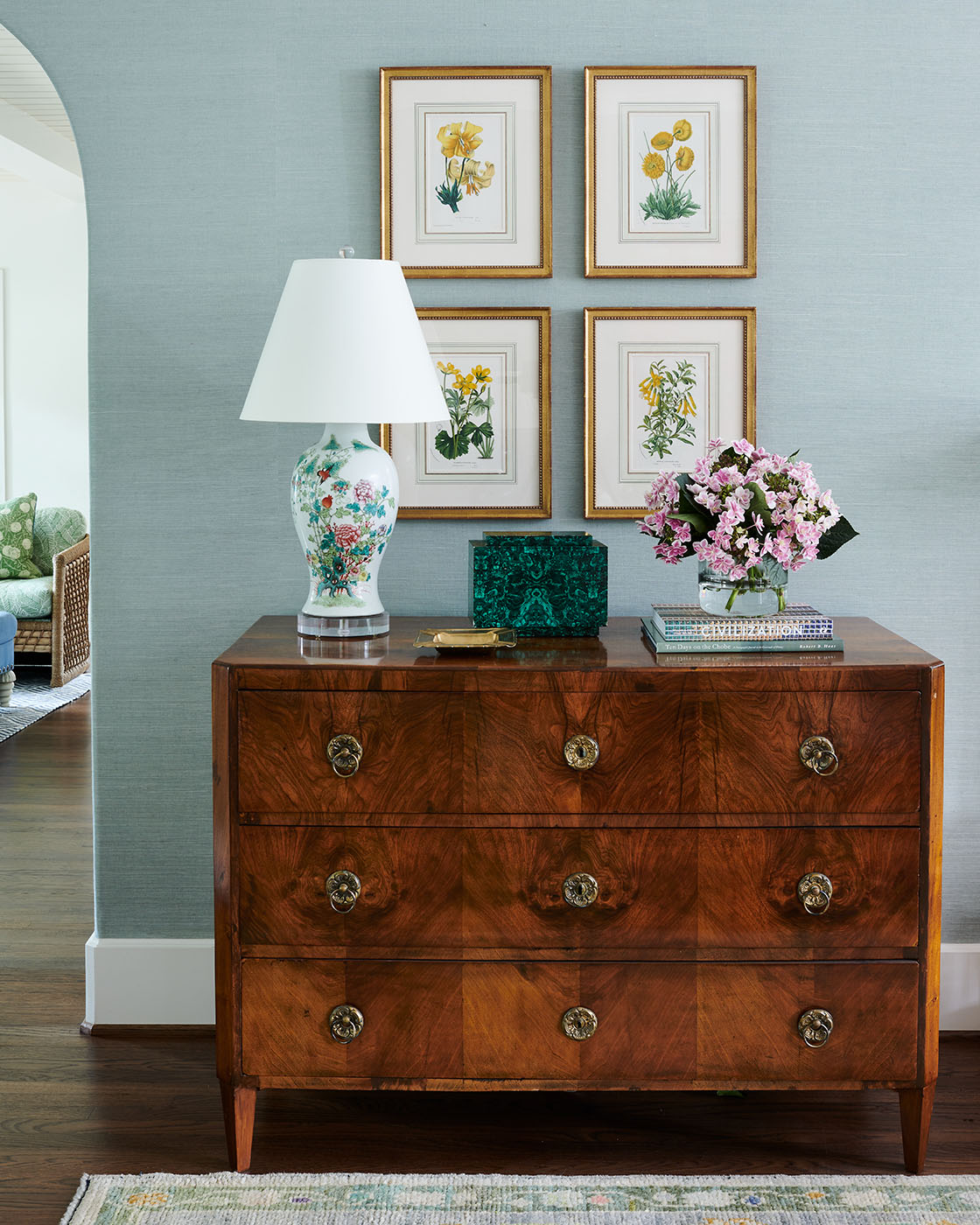 Brown cabinet under grid of prints by Madre design in Southern Living Magazine in Dallas Texas by Alison Gootee Photography