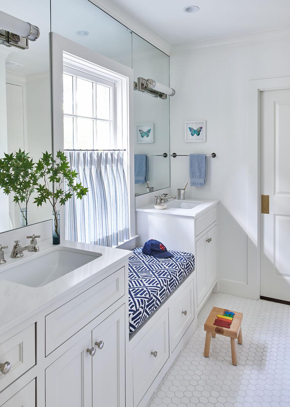 Small bathroom with window Blue seating area by Madre design in Southern Living Magazine in Dallas Texas by Alison Gootee Photography