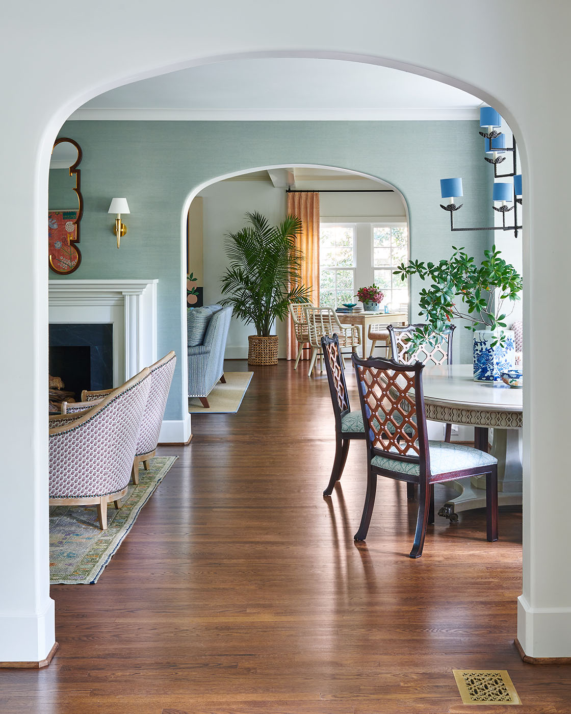 View through archways Blue seating area by Madre design in Southern Living Magazine in Dallas Texas by Alison Gootee Photography