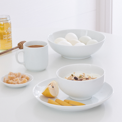 Muji bowls on white table  by Alison Gootee Photography