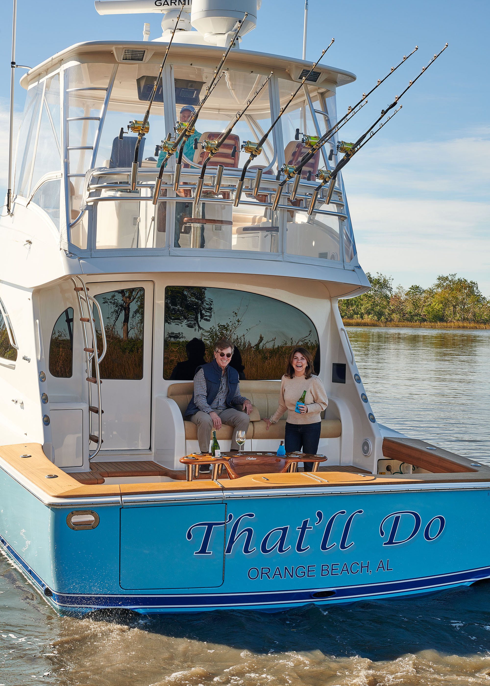 Fabulous couple on a sunny yacht in Louisiana at a camp designed by Melissa Rufty by Alison Gootee photography