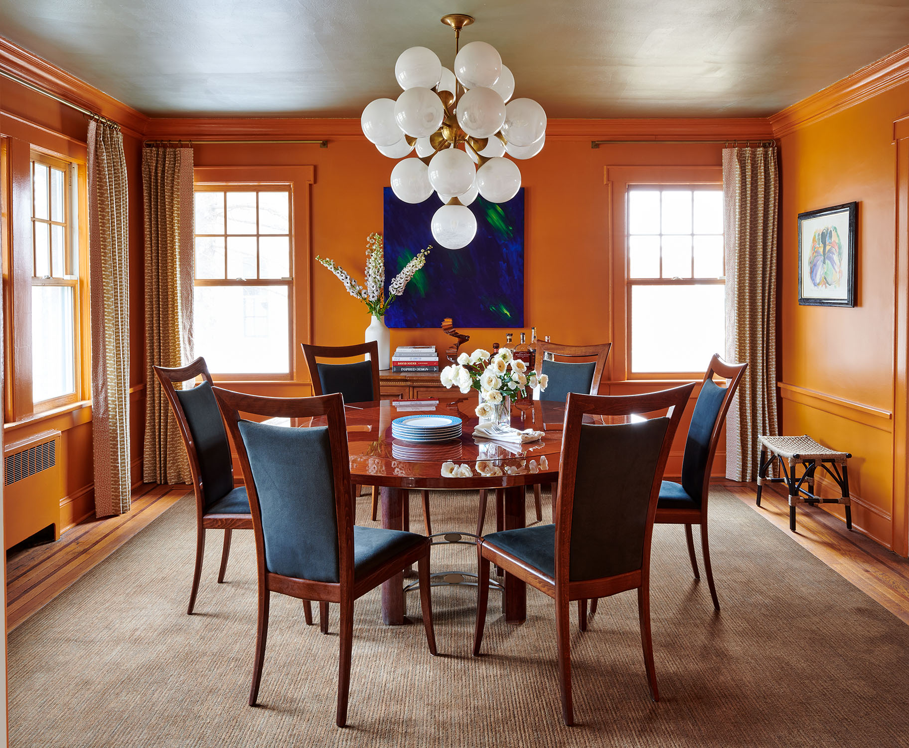 High gloss orange dining room of Gail Davis for Frederic Magazine by Alison Gootee