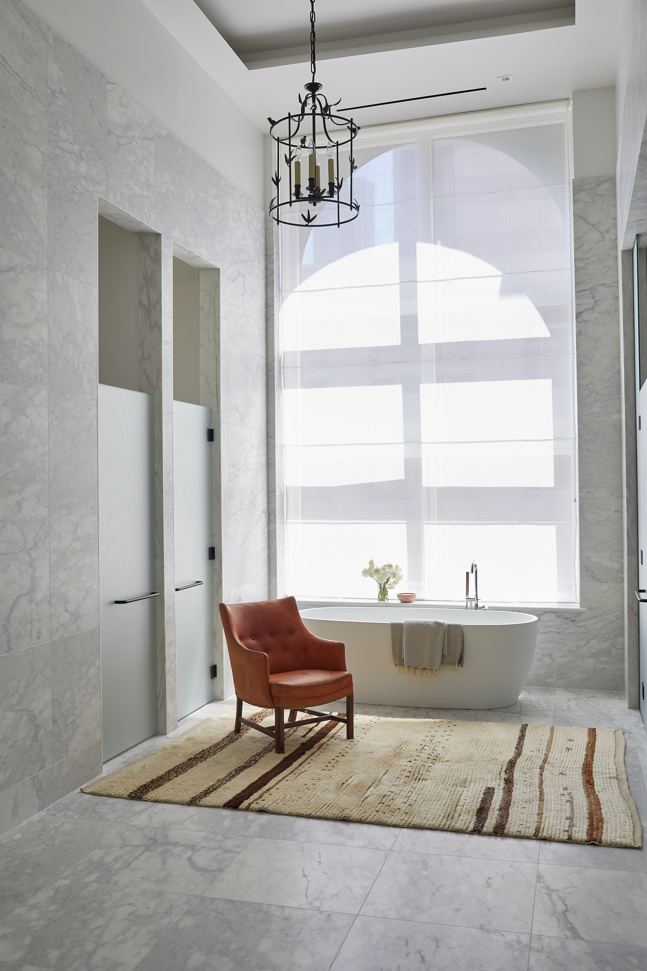 Large marble bathroom with soaking bath tub Elle Decor Magazine by Alison Gootee Photography