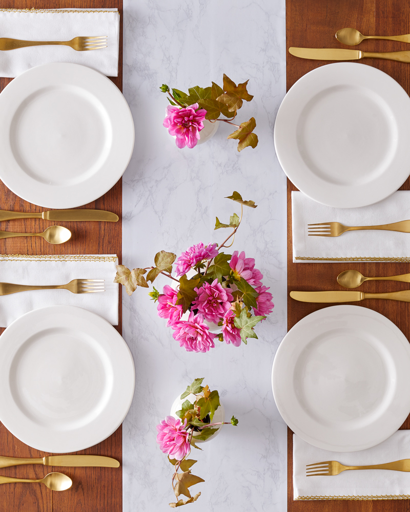 overhead of tablescape and Table-Runner with white plate pink flowers Still-life by Alison Gootee Photography
