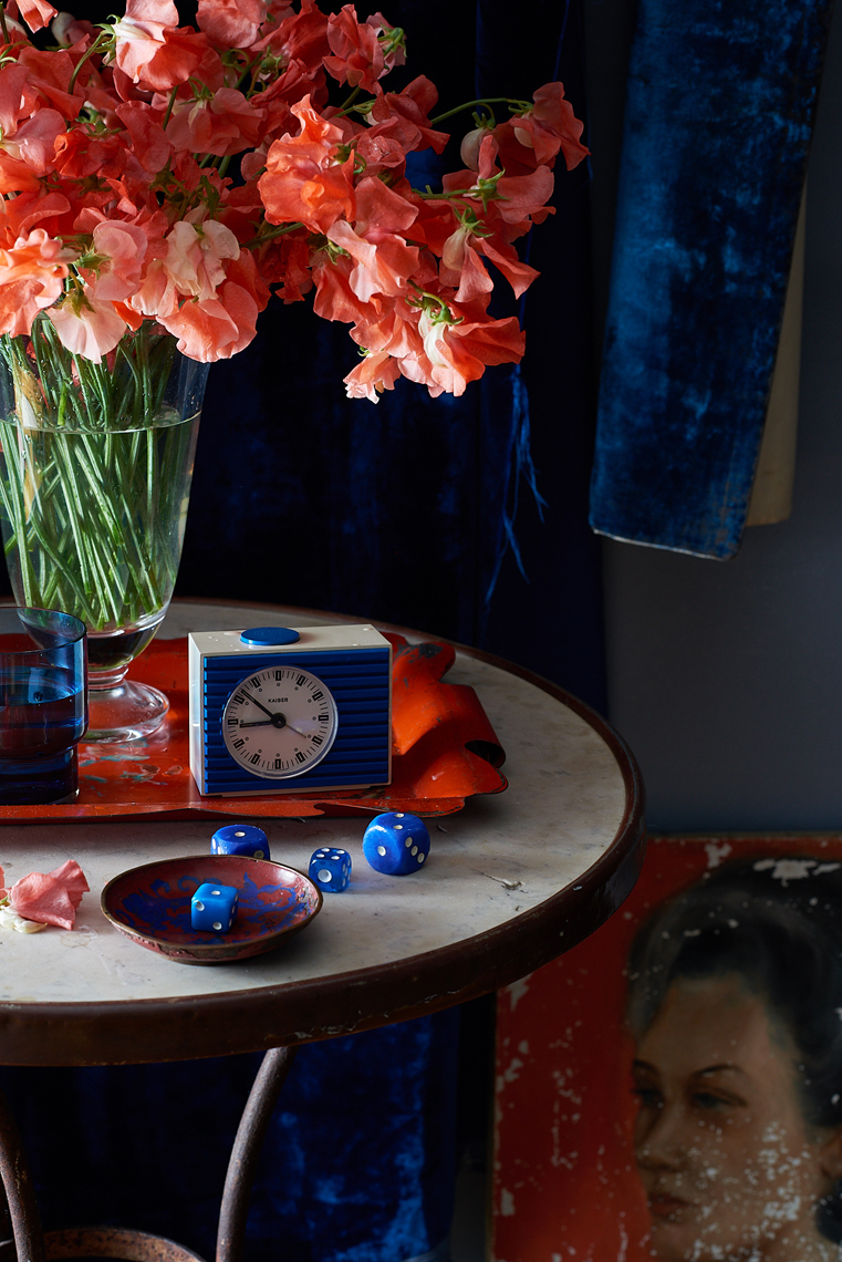 Moody table-top with sweet pea flowers painted portrait and vintage items Still-life by Alison Gootee Photography