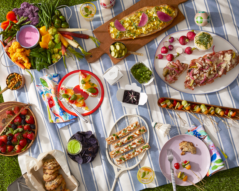 Picnic on a striped blanket with crudite olives salads beautiful light is food photography by Alison Gootee Photography