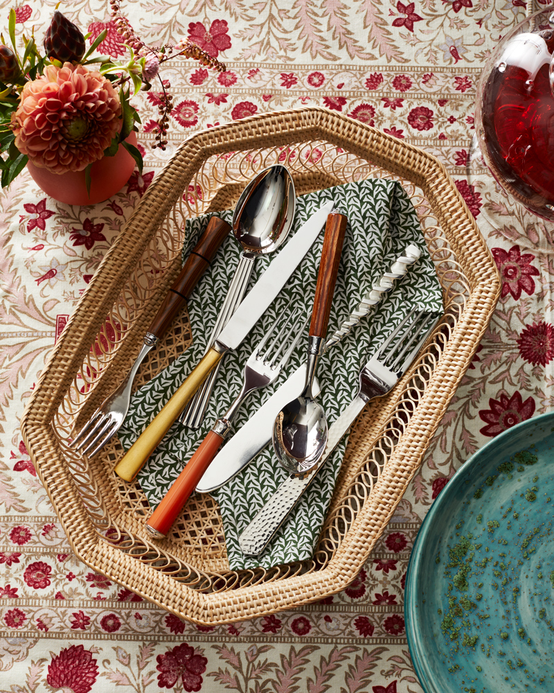 straw basket of cutlery on block pattern table clothe Still-life by Alison Gootee Photography