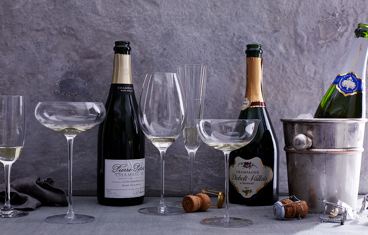 bottles of Champagne and champagne stemware is food photography by Alison Gootee Photography