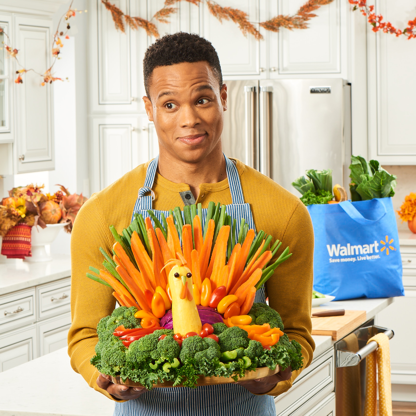 man holding thanksgiving vegatable centerpiece for Walmart by Alison Gootee Photography