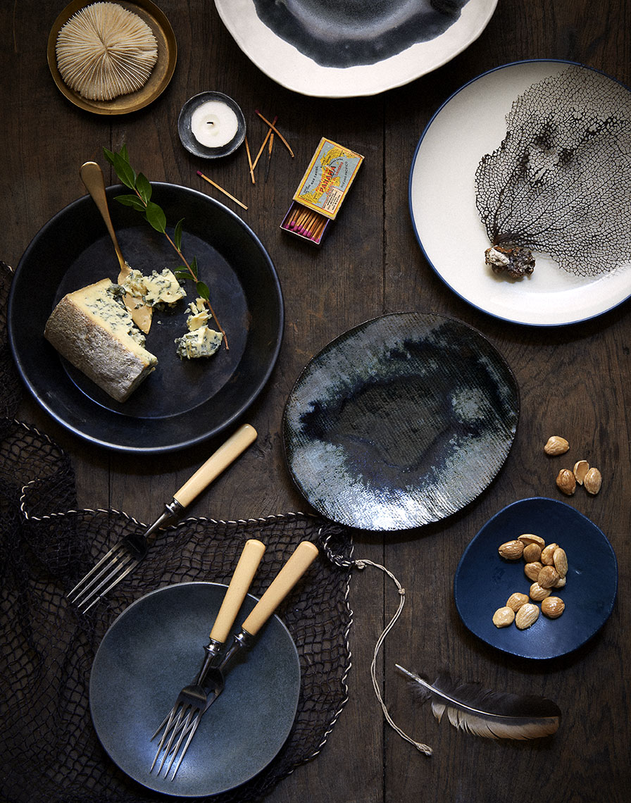 Moody dark plates cheese  nuts snacks Still-life by Alison Gootee Photography
