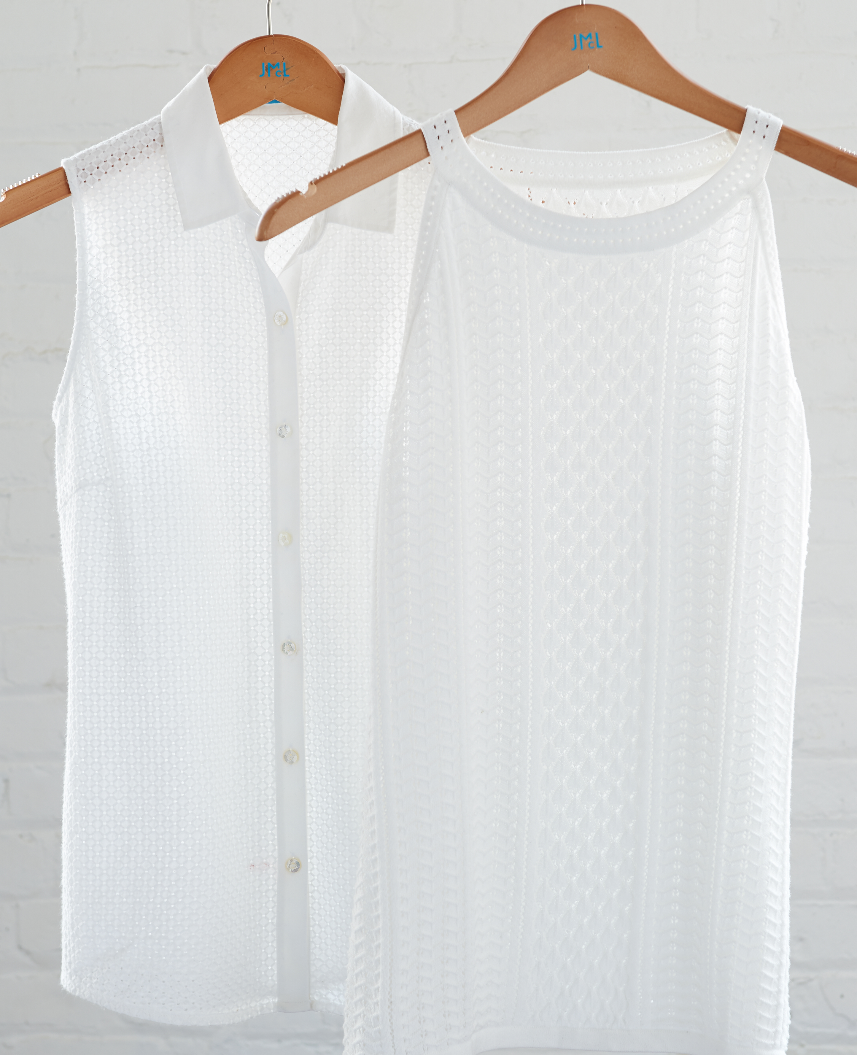Two White Shirts on hangers with daylight by Alison Gootee Photography 